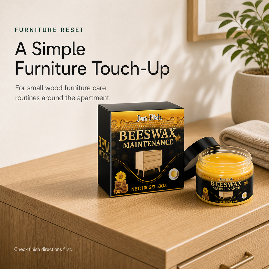 Beeswax Furniture Polish styled on a wood cabinet for small apartment furniture touch ups